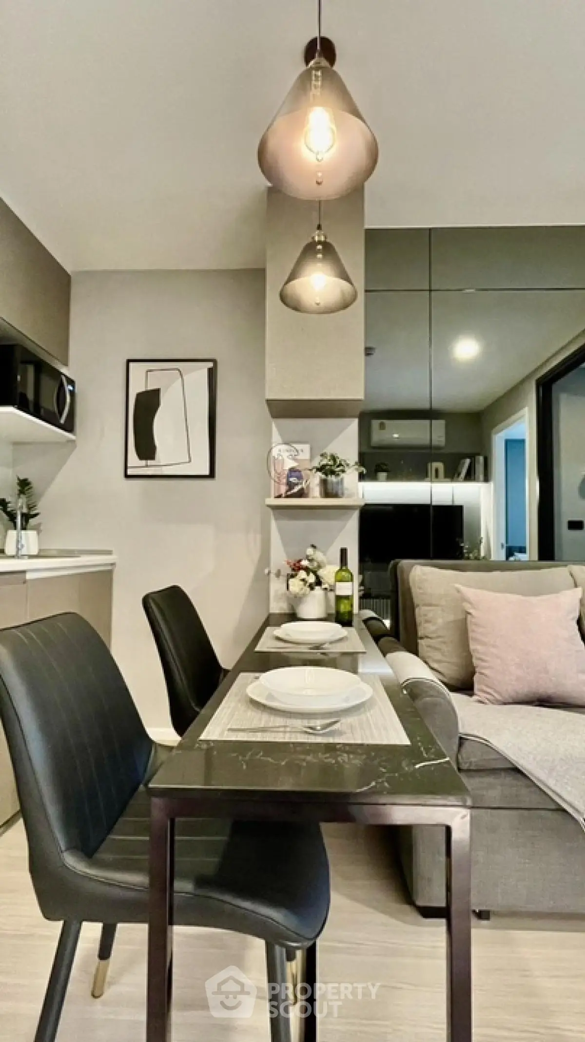 Modern living room with stylish dining area and contemporary lighting