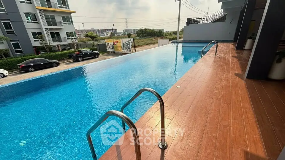 Luxurious apartment complex with stunning outdoor pool and modern amenities.