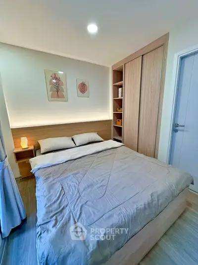 Cozy modern bedroom with stylish decor and ample storage space