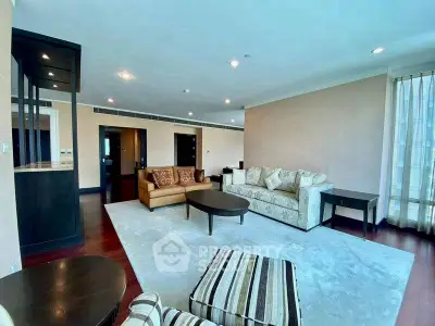 Spacious living room with elegant furniture and ample natural light