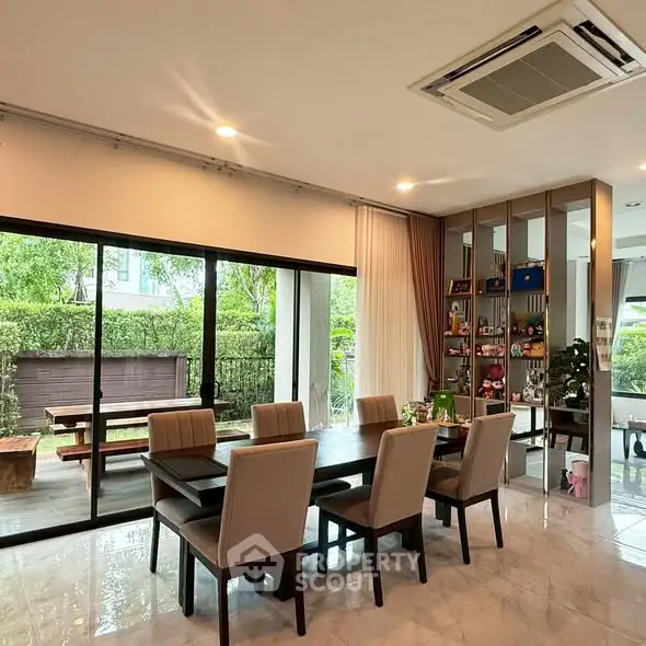 Elegant dining area with garden view and modern decor