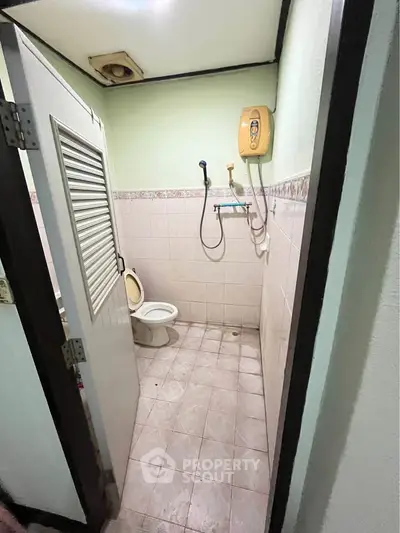 Compact bathroom with shower and toilet in a real estate property