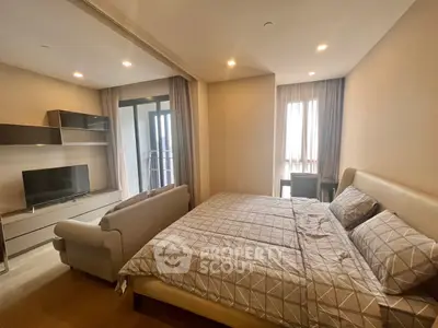 Spacious modern bedroom with balcony access and stylish decor