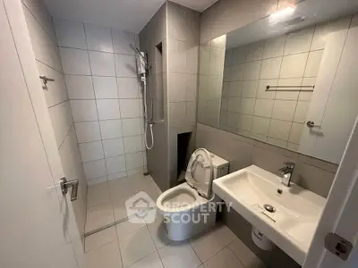 Modern bathroom with sleek tiles and contemporary fixtures