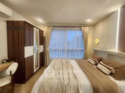 Cozy bedroom with modern decor and ample natural light