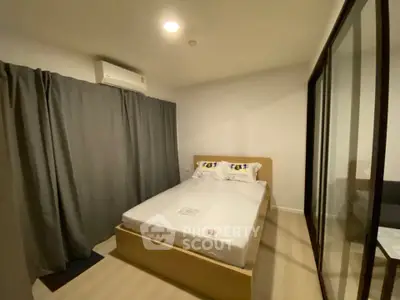 Cozy bedroom with modern design and ample natural light