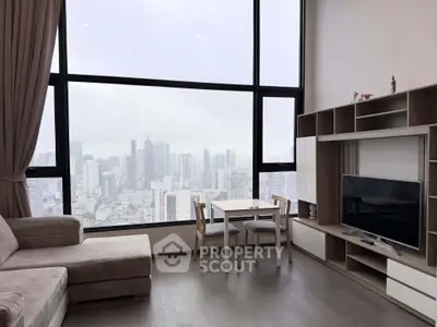 Modern living room with panoramic city view, featuring sleek furniture and large windows.