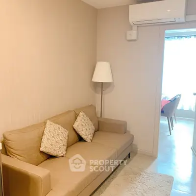 Cozy living room with beige sofa and modern decor in a stylish apartment