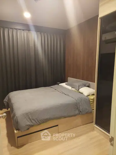 Cozy bedroom with modern decor and ample natural light