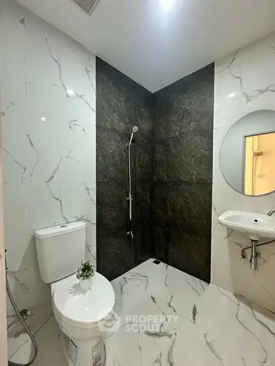 Modern bathroom with elegant marble tiles and sleek fixtures