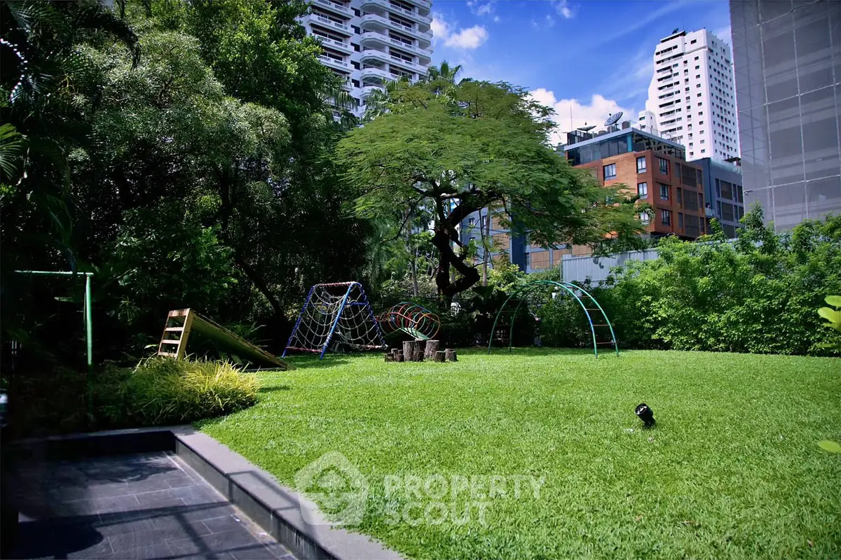Spacious urban garden with playground equipment and lush greenery
