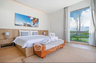 Luxurious bedroom with large window and elegant decor in modern home