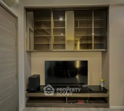 Modern living room with sleek TV unit and ample storage space