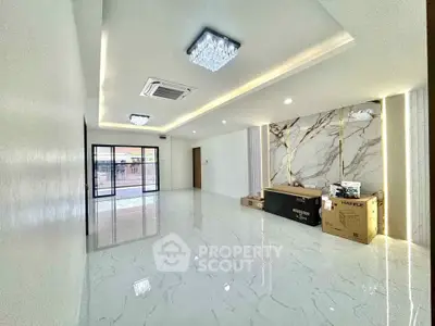 Spacious modern living room with marble flooring and elegant lighting