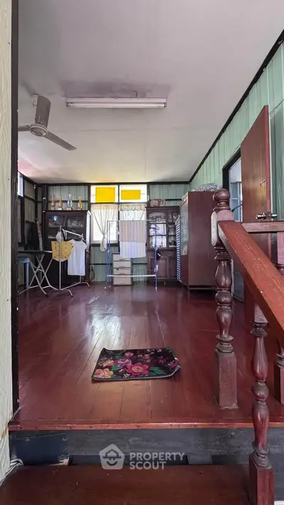 Charming vintage interior with wooden floors and rustic decor, perfect for cozy living.