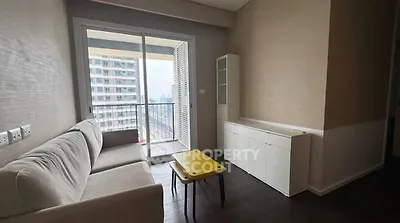 Modern living room with balcony view in urban apartment
