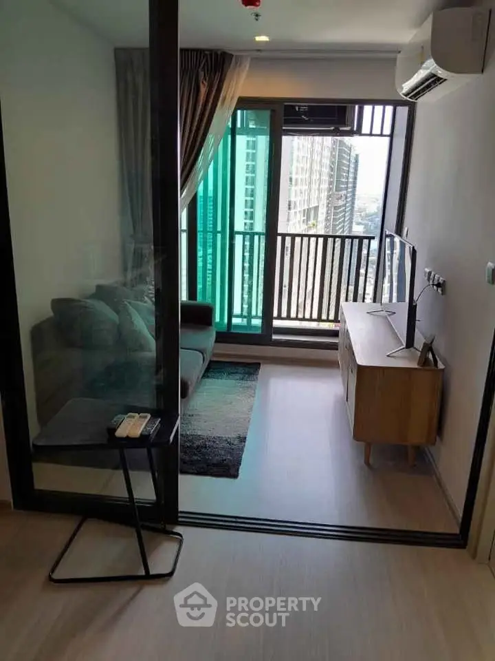 Modern living room with balcony view in high-rise apartment