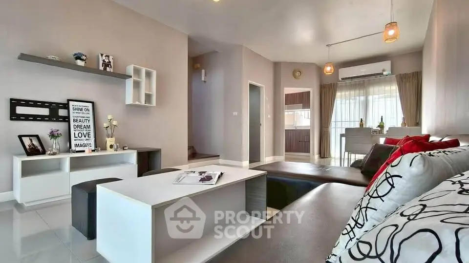 Spacious modern living room with stylish decor and open layout, perfect for entertaining.