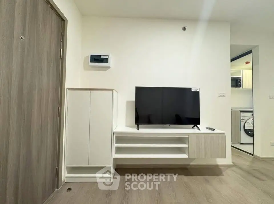 Modern living room with sleek TV setup and stylish storage solutions