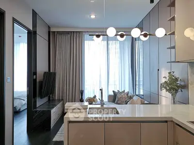 Modern open-layout kitchen and living room with elegant lighting and large windows.
