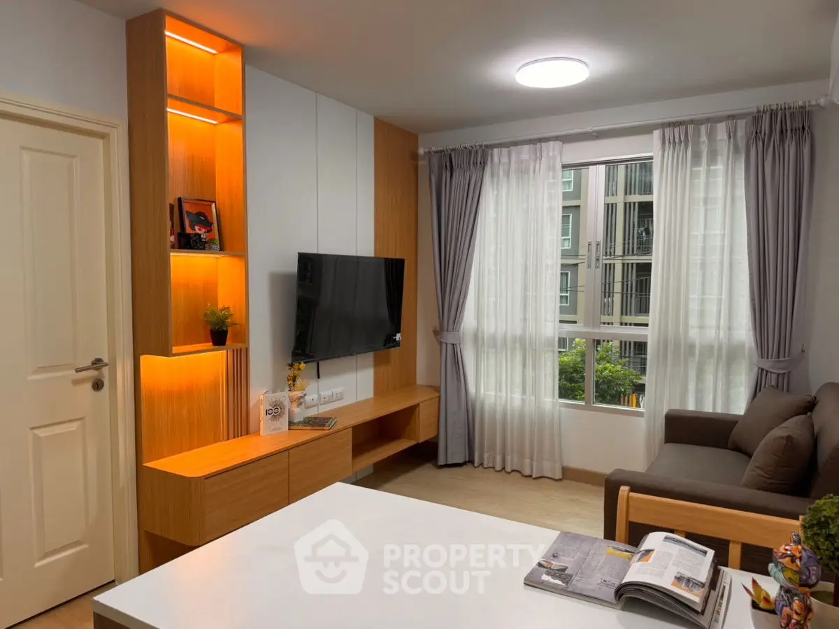 Modern living room with stylish wooden furniture and large window view.