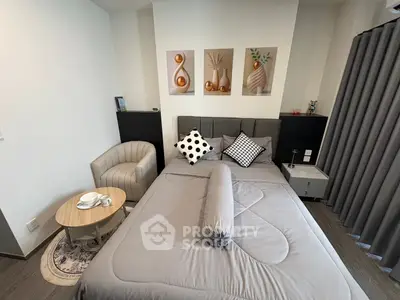 Cozy modern bedroom with stylish decor and comfortable seating area