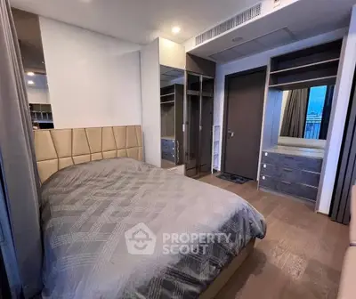 Modern bedroom with stylish decor and ample storage space