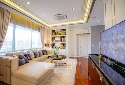 Luxurious living room with elegant decor and large windows offering natural light.
