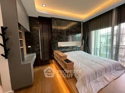 Luxurious modern bedroom with elegant lighting and balcony view