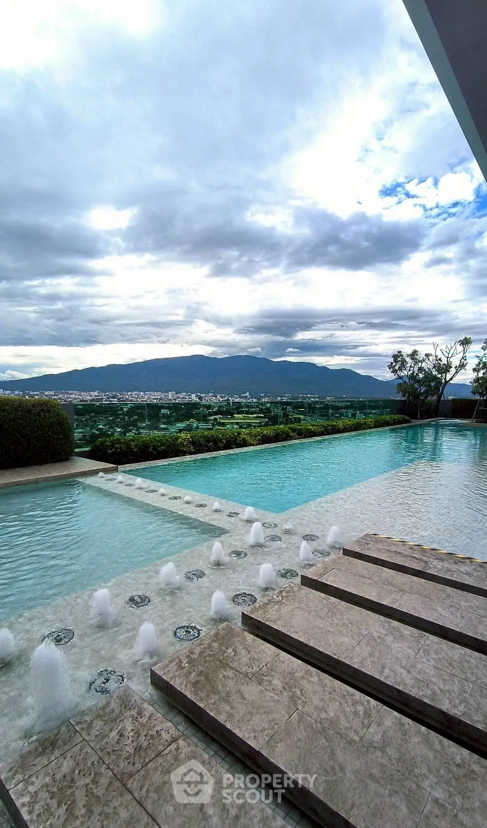 Luxurious infinity pool with stunning mountain and city views