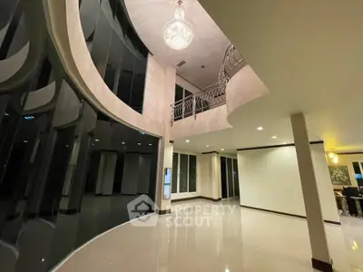 Luxurious modern interior with high ceilings and elegant chandelier
