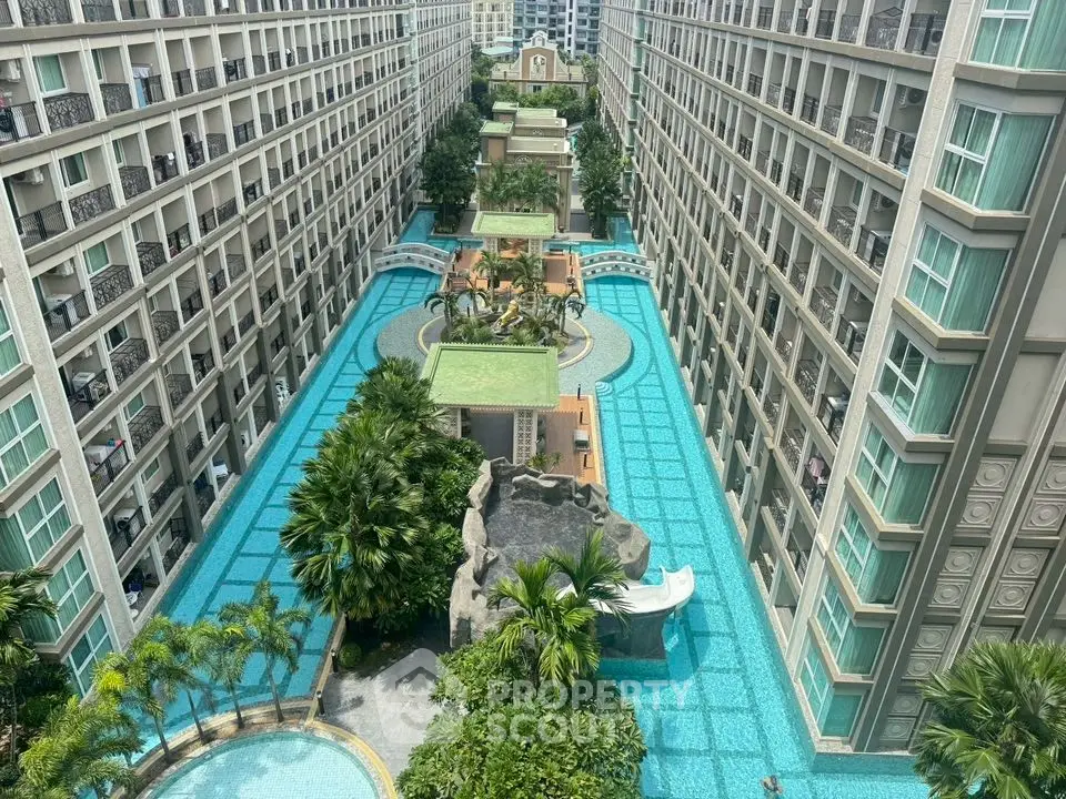 Luxurious apartment complex with stunning pool and lush greenery