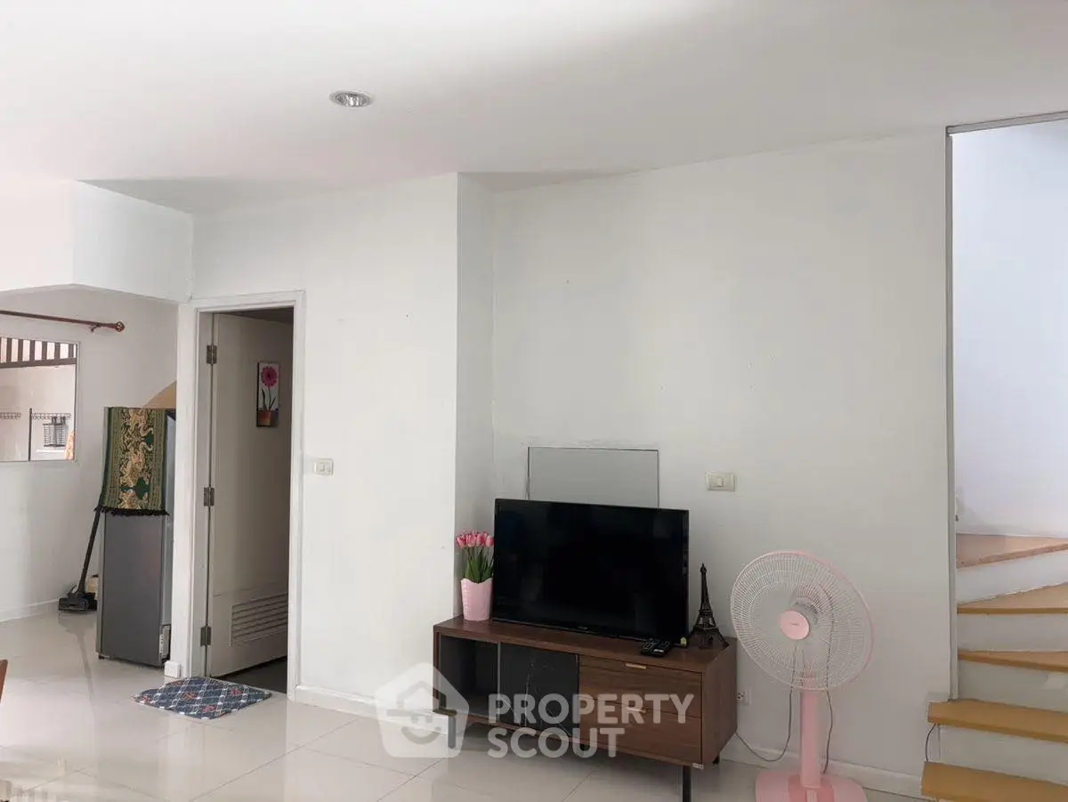 Modern living room with TV and minimalist decor