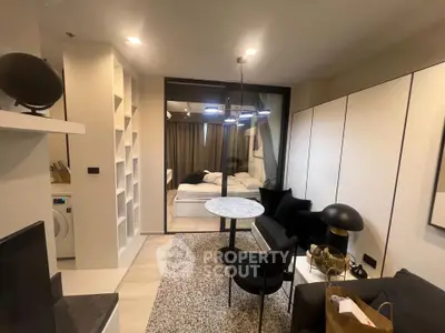 Modern living room with cozy seating and stylish decor in a contemporary apartment.