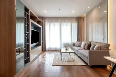 Modern living room with sleek design, large windows, and stylish furniture in a luxury apartment.