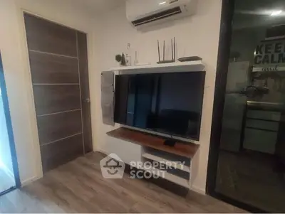 Modern living room with sleek TV unit and air conditioning