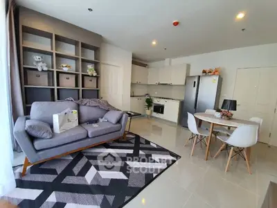 Modern living room with open kitchen and stylish decor