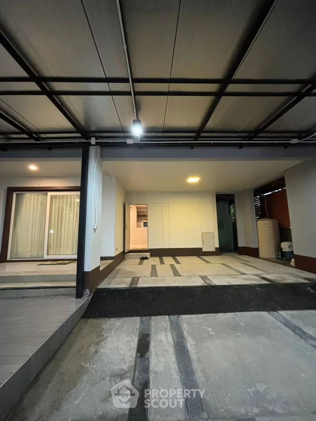 Spacious covered parking area with modern design and ample lighting