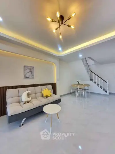 Modern living room with stylish lighting and cozy seating area