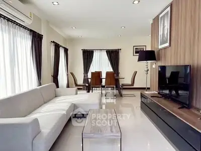 Spacious modern living room with elegant decor and dining area