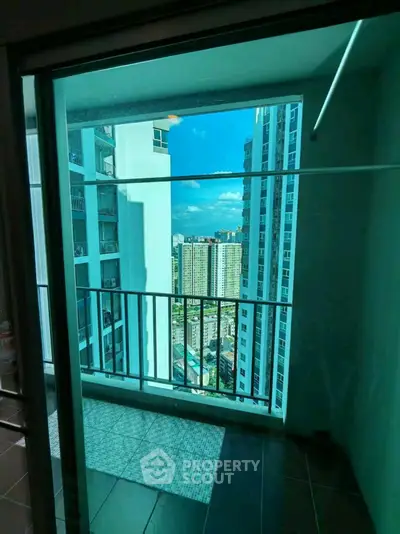 Stunning high-rise balcony view with cityscape backdrop, perfect for urban living enthusiasts.