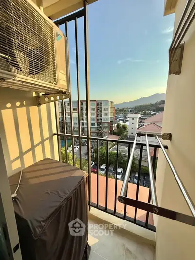 Charming balcony with scenic city view, perfect for relaxation and enjoying sunsets.