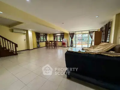 Spacious living room with open layout and large windows for natural light