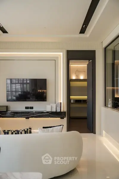 Luxurious modern living room with sleek design and ambient lighting
