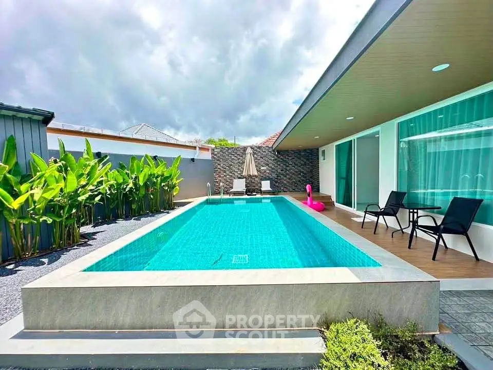 Luxurious modern villa with private pool and lush garden, perfect for relaxation and entertainment.