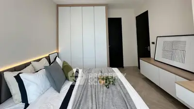 Modern bedroom with stylish decor and ample storage space