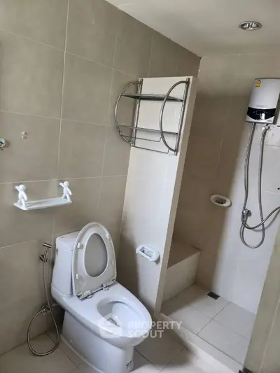 Modern bathroom with shower and toilet in neutral tones