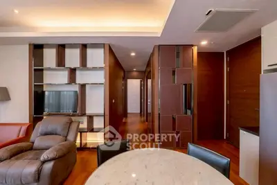 Luxurious living room with modern furniture and elegant wooden accents