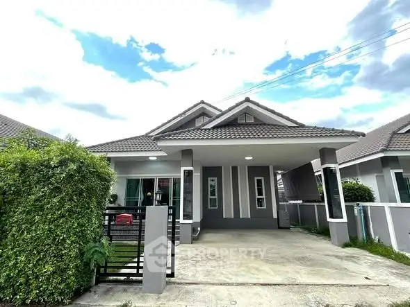 Charming single-story house with modern design and spacious driveway in a serene neighborhood.