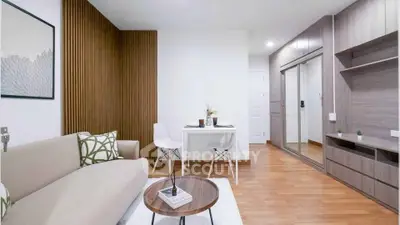 Modern living room with stylish decor and wooden accents, perfect for urban living.